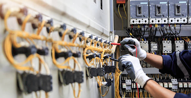 Professional Electrician technician working in Jupiter Farms, FL